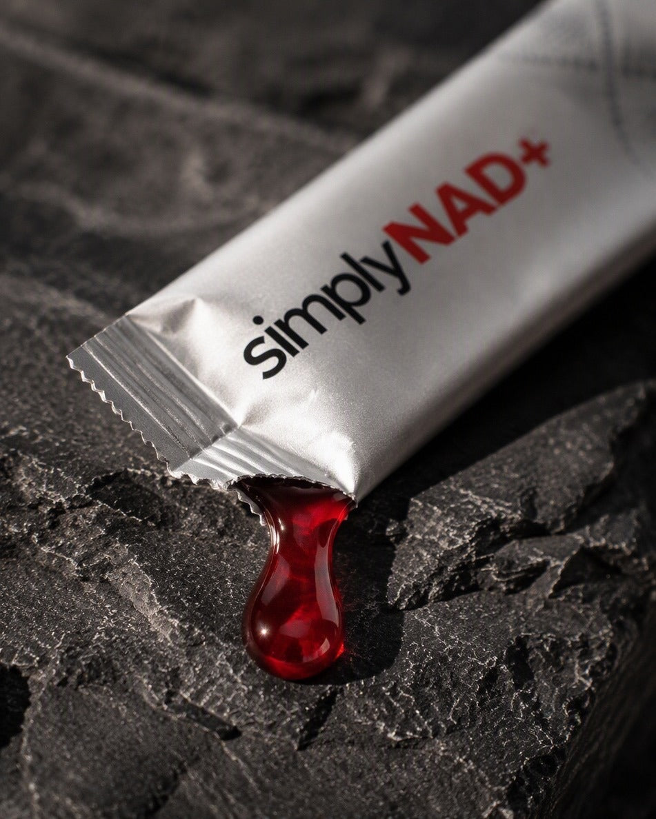 simplyNAD+ liquid NAD+ shot pouring from the packet